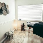 white and black round table near white wall